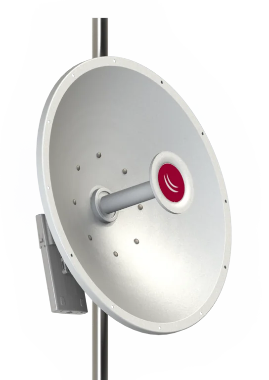White satellite dish antenna mounted on a vertical pole with the feed horn (LNB) on an arm extending toward the dish edge