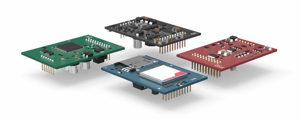 Four colored circuit boards with components floating in midair, showing an exploded electronic assembly.